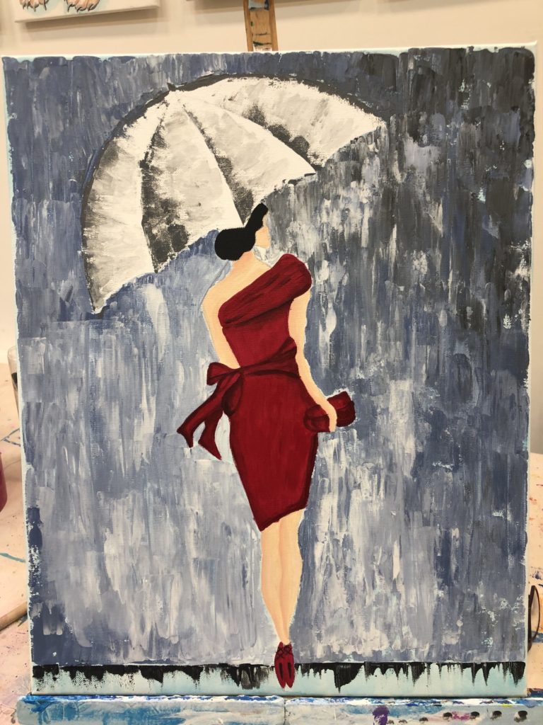 Piros ruhás hölgy az esőben